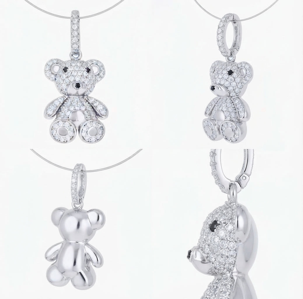 Close-up of 925 sterling silver teddy bear pendant with white and black moissanite