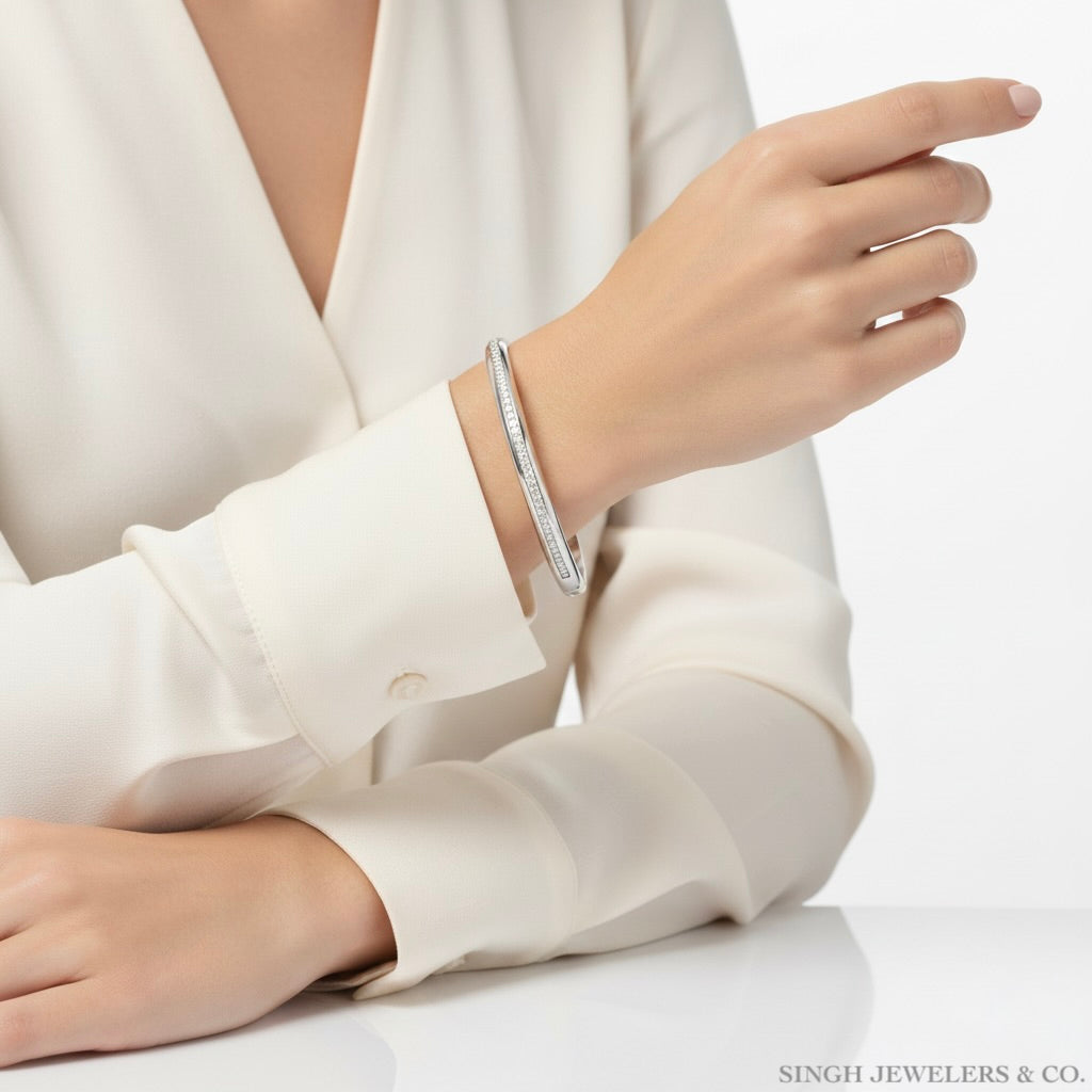 Hand wearing a silver bracelet on a white background with 'SINGH JEWELLERS & CO.' branding.