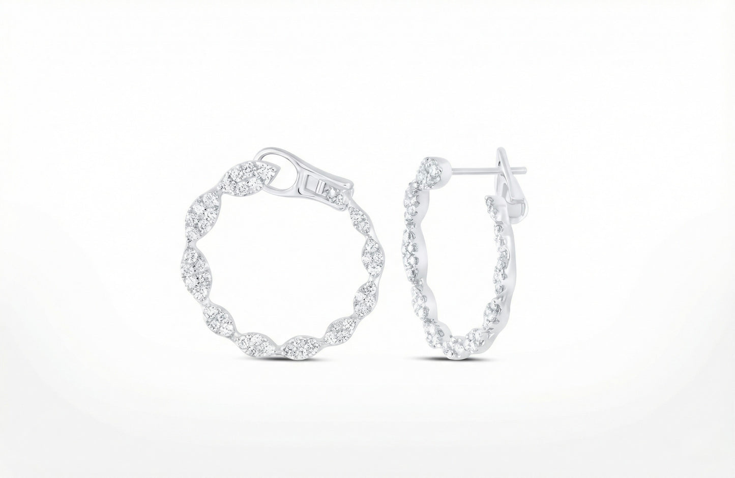 Pair of silver hoop earrings on a white background
