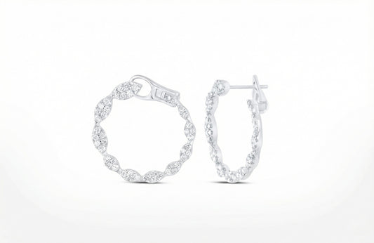 Pair of silver hoop earrings on a white background