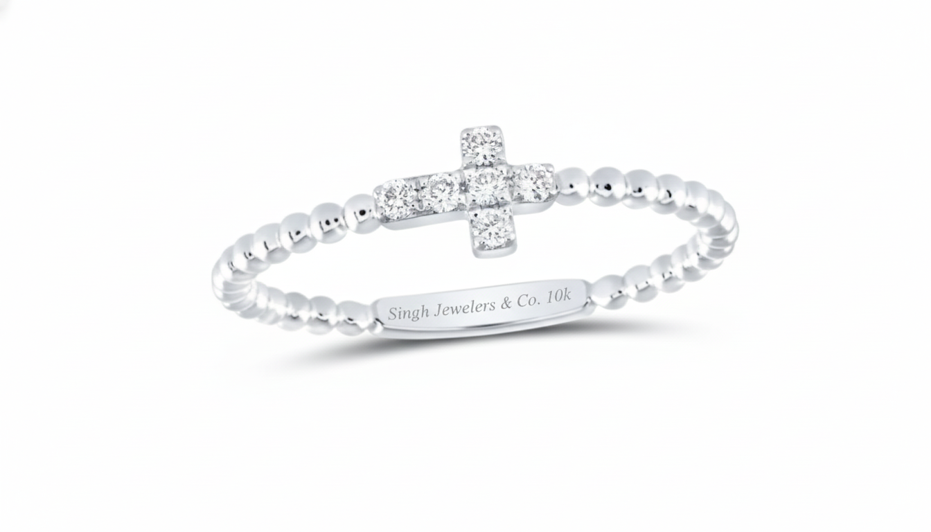 Silver ring with diamond accents on a white background