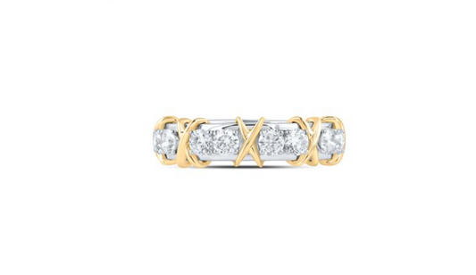 Gold and silver ring with diamonds on a white background