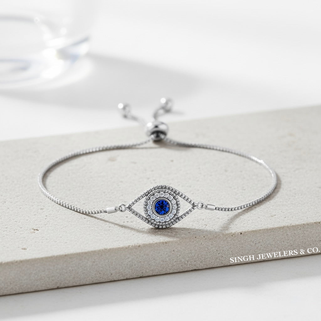 925 sterling silver evil eye bolo bracelet with blue and white cubic zirconia stones for women