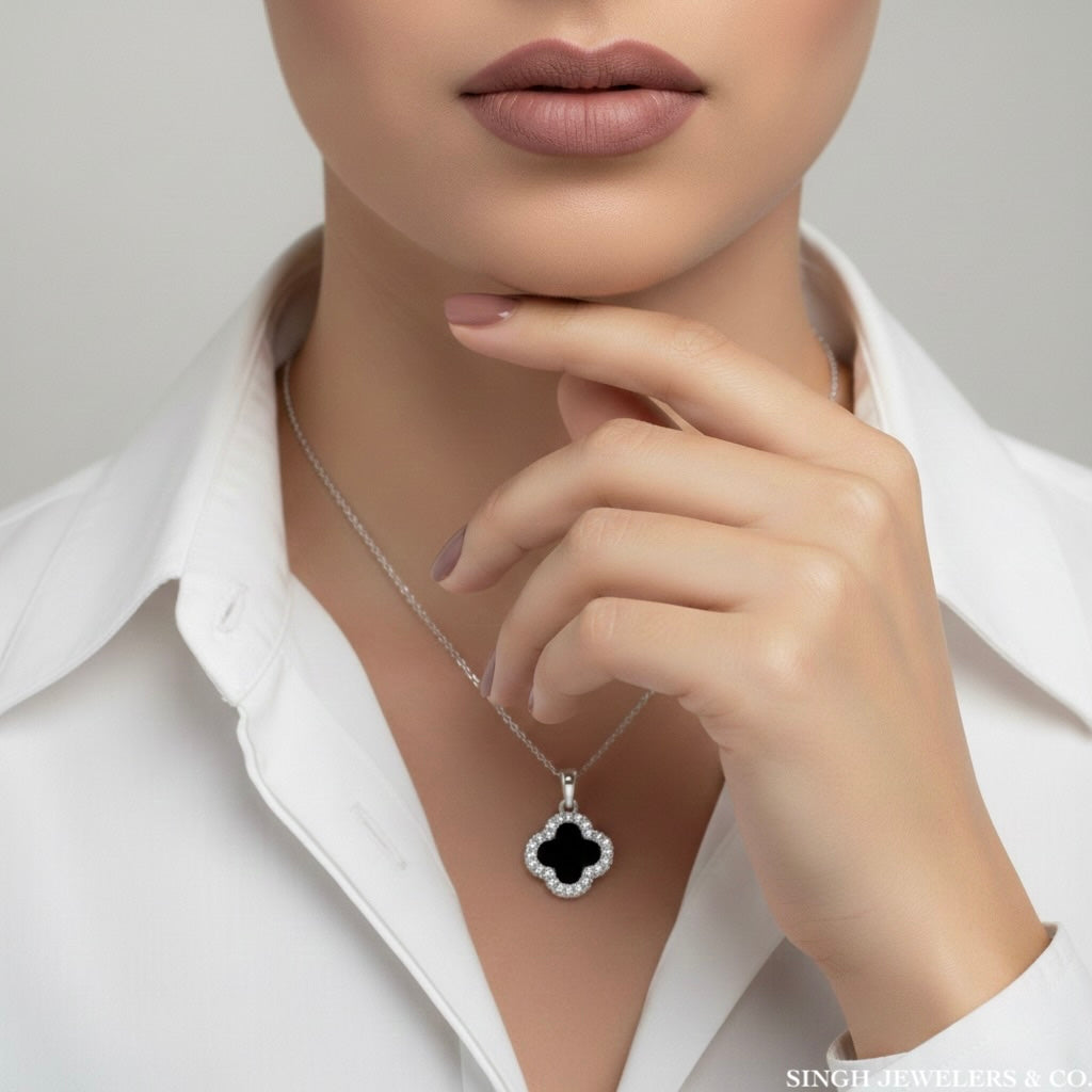 Black and white sapphire clover charm worn on model, Van Cleef inspired