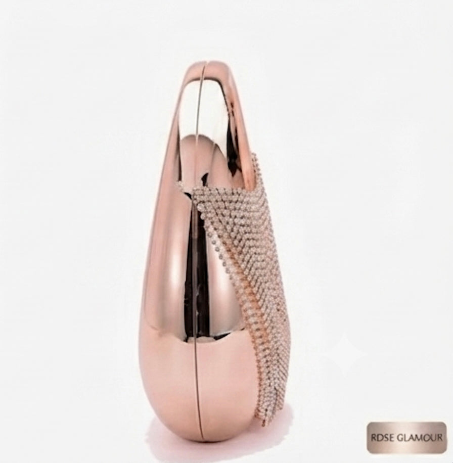 A metallic rose gold evening clutch bag with a sparkling rhinestone-embellished side panel, shown on a plain white background with a 'ROSE GLAMOUR' label in the bottom right corner.