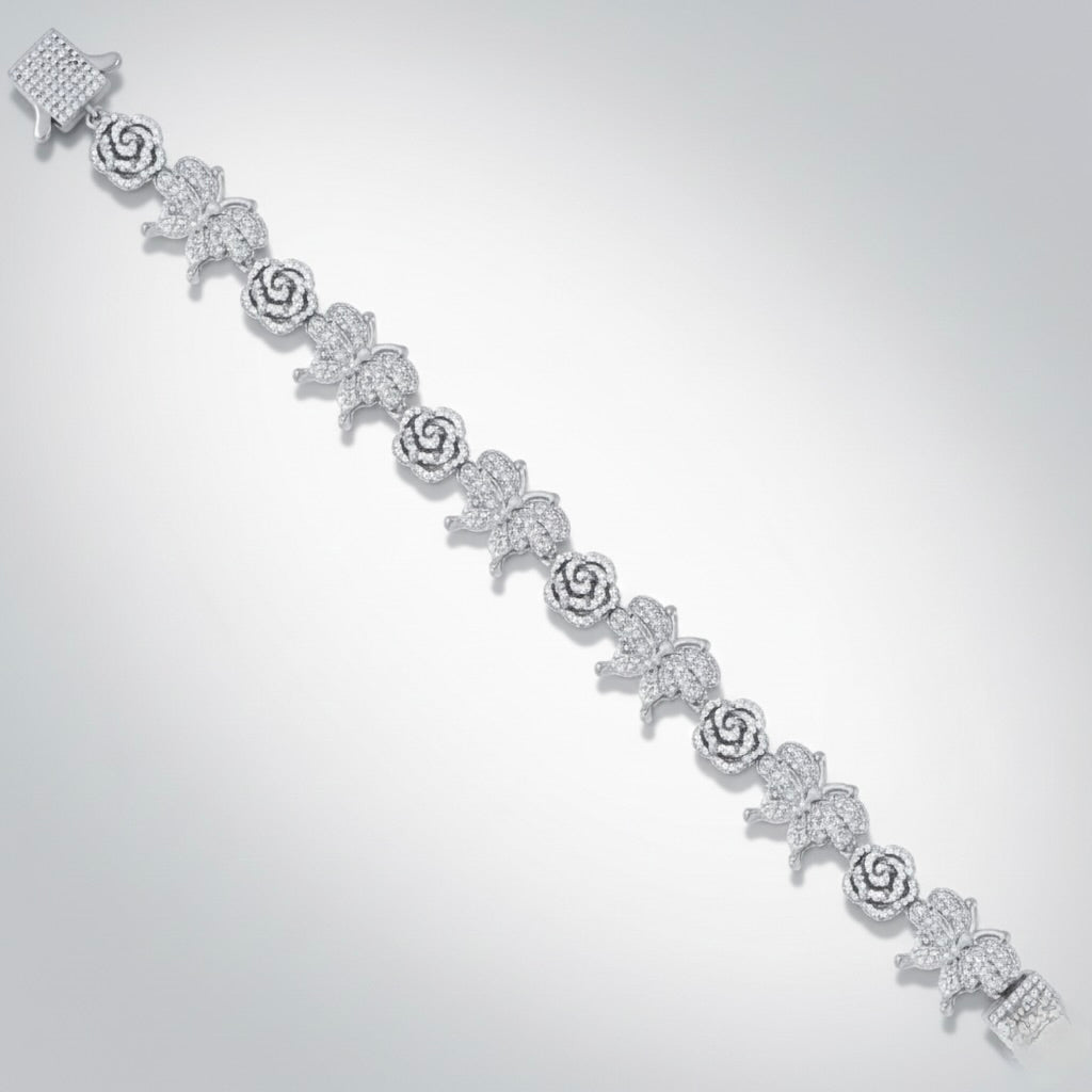 Silver bracelet with floral designs on a light gray background