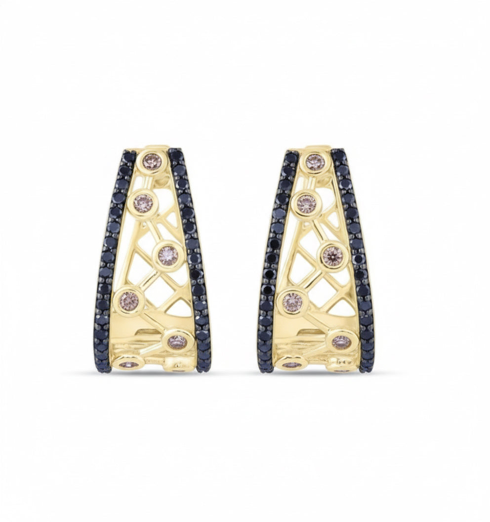 Gold hoop earrings with embedded gemstones on a white background
