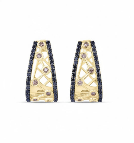 Gold hoop earrings with embedded gemstones on a white background