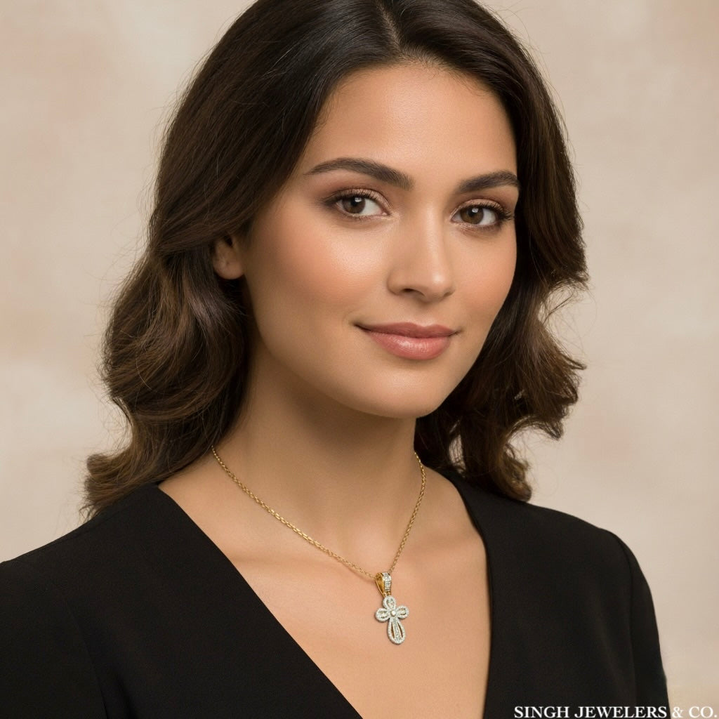 Woman wearing a necklace with a cross pendant against a neutral background