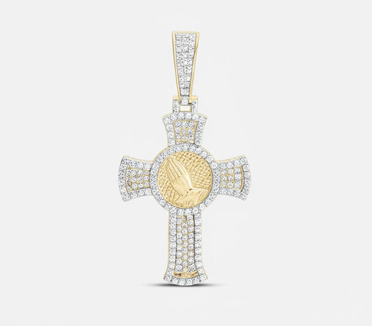 Gold cross pendant with a central round emblem on a light gray background