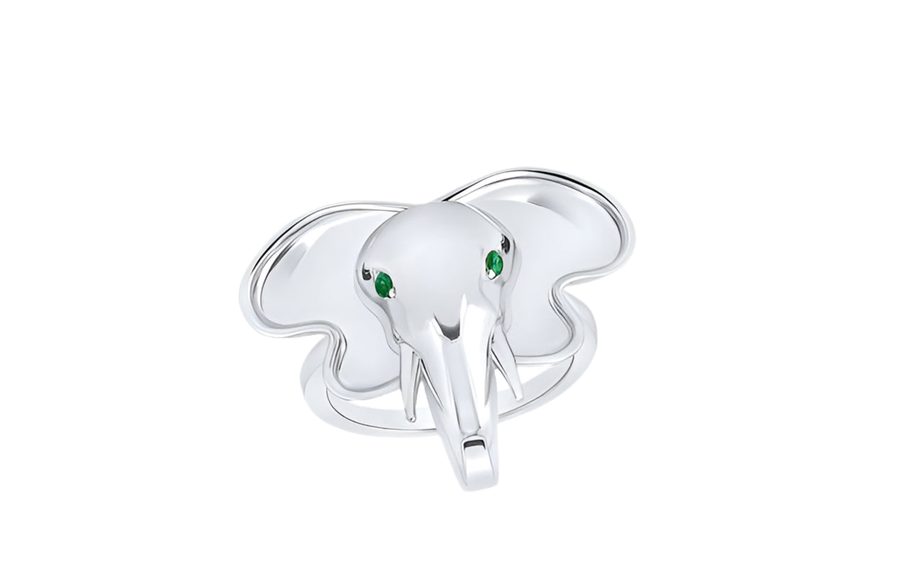 Sterling silver elephant ring with round emeralds on white background