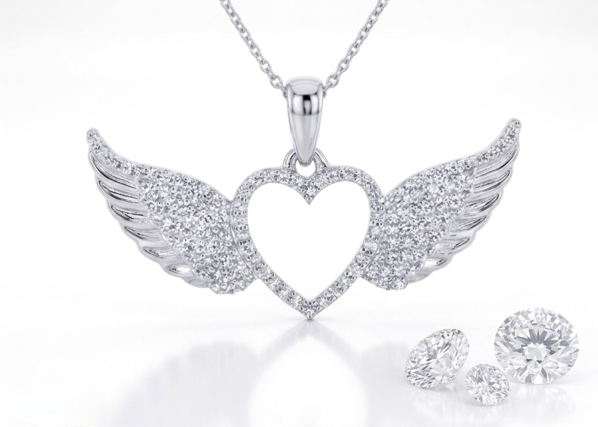 Close up view of women’s 10K gold diamond heart wings pendant