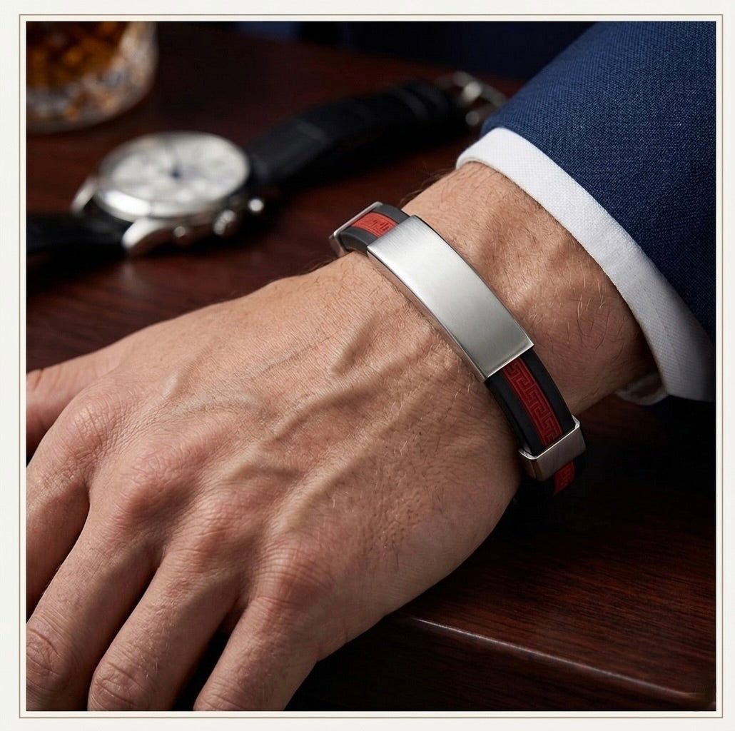 Men’s black stainless steel cuff bracelet with red stripe worn on wrist