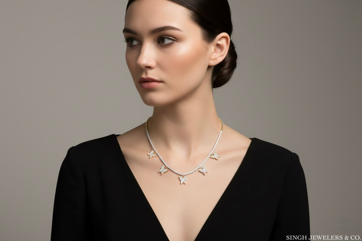Woman wearing a silver necklace against a gray background, with 'Singh Jewelers & Co' branding.