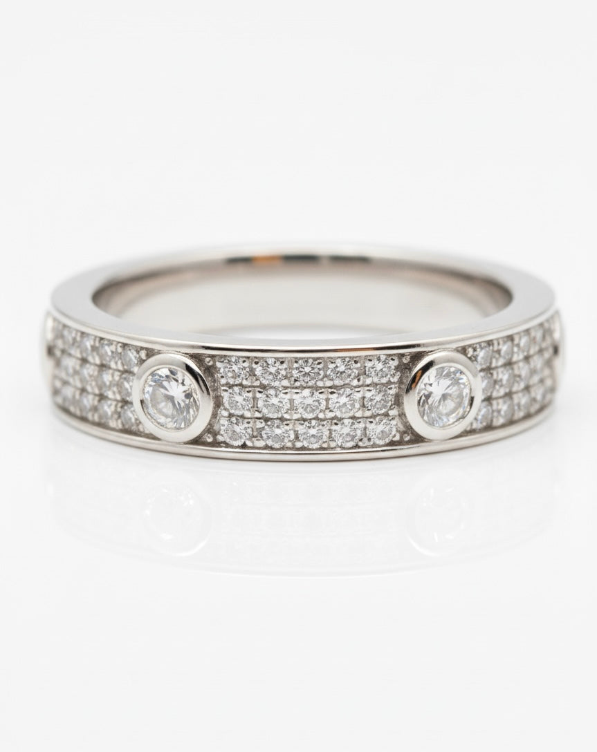 Close-up of sterling silver Love Ring with round moissanite stones