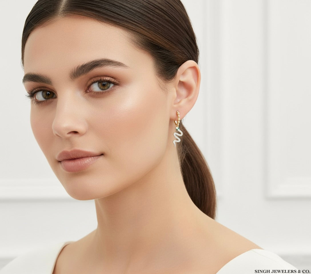 1 CTW natural diamond and 1/6 CTW marquise emerald snake hoop earrings in 14K yellow gold