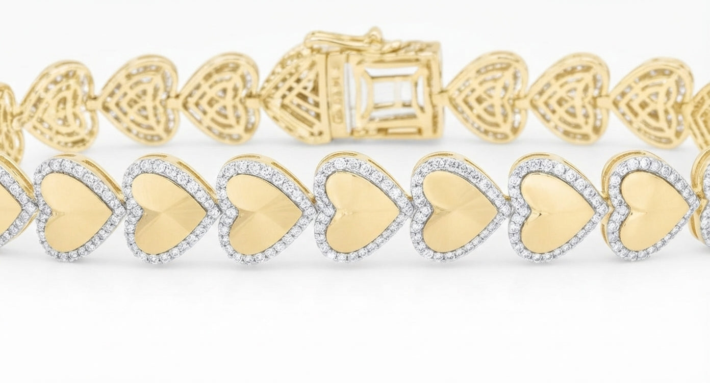 A close-up of a heart-link bracelet featuring alternating polished yellow gold hearts and pavé-set clear stones in a silver-toned setting, with a matching gold heart clasp visible at the top.
