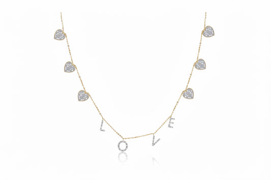 Necklace with heart-shaped pendants spelling 'LOVE' on a white background