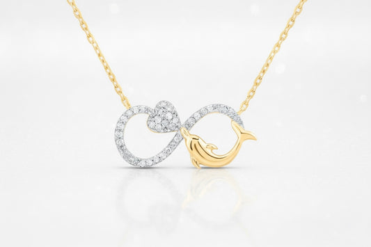 Gold and silver necklace with a dolphin design on a white background