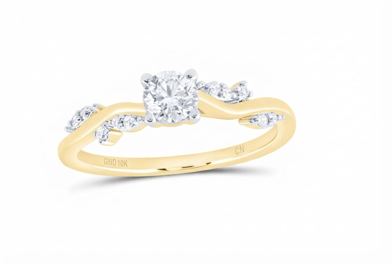 Close-up of round natural diamonds on 10K yellow gold vine promise ring
