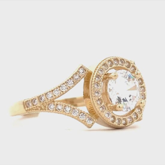 14K yellow gold engagement ring featuring a round cubic zirconia center stone with a sparkling halo setting movie