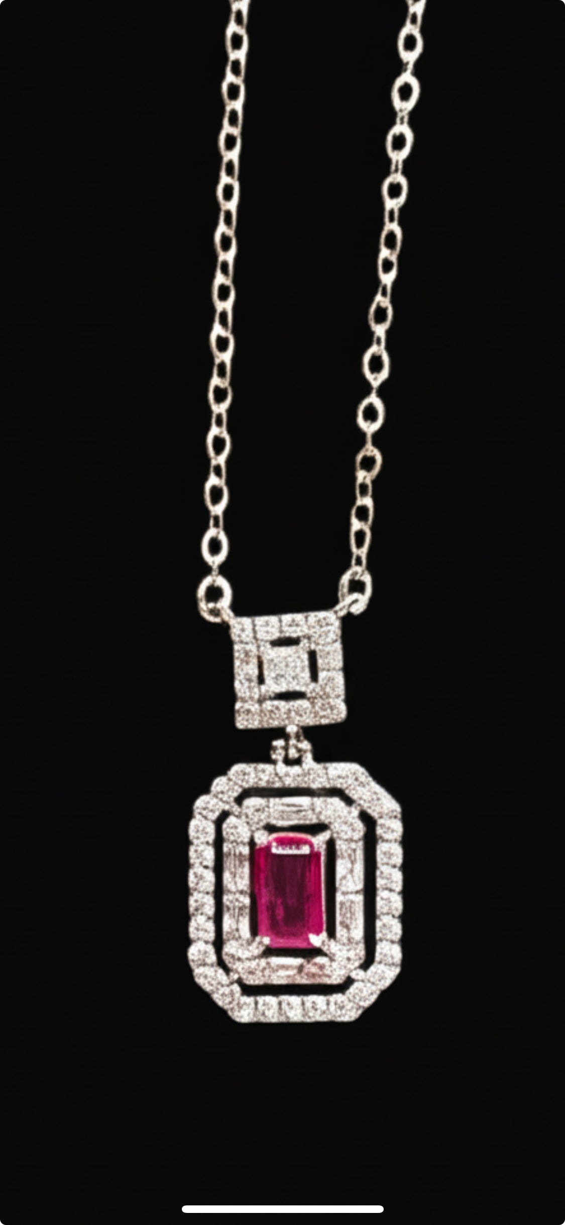 Sterling silver necklace with emerald cut ruby cubic zirconia pendant