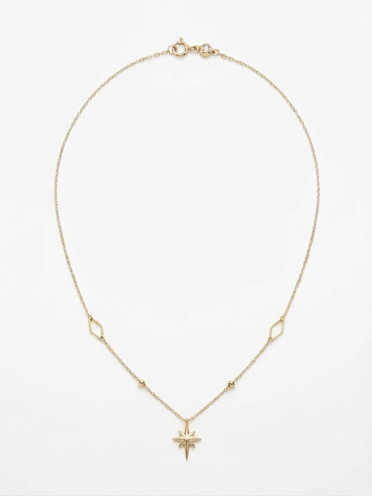 10K yellow gold paperclip link necklace featuring a radiant starburst pendant, geometric stations, and a 17-inch chain with a 1-inch extender.