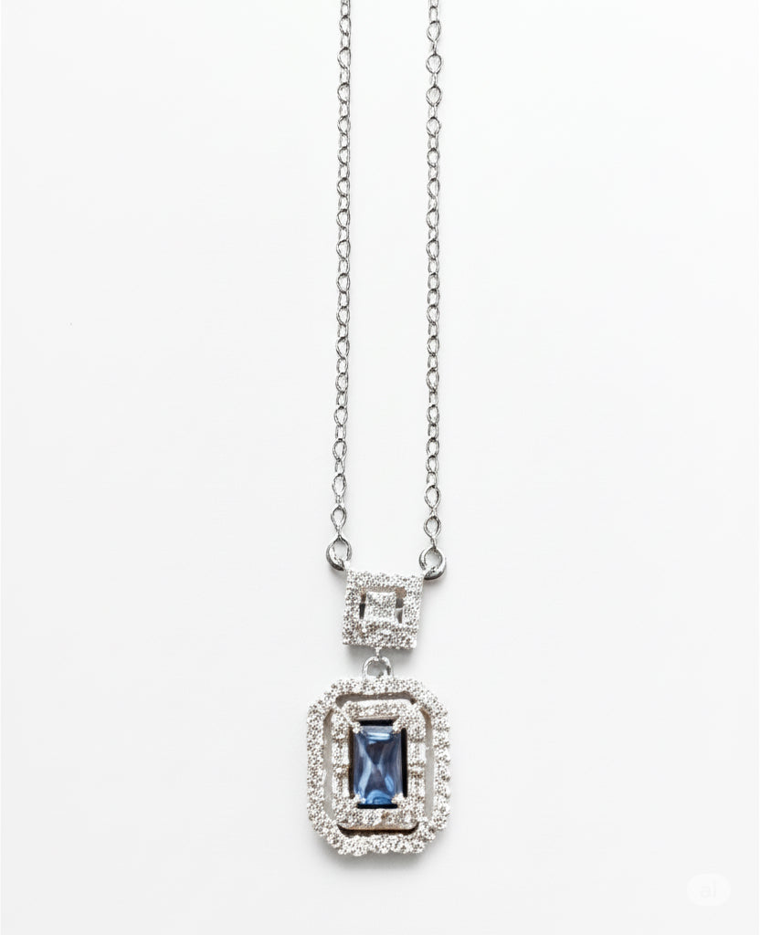 Sterling silver necklace with emerald cut blue topaz CZ pendant