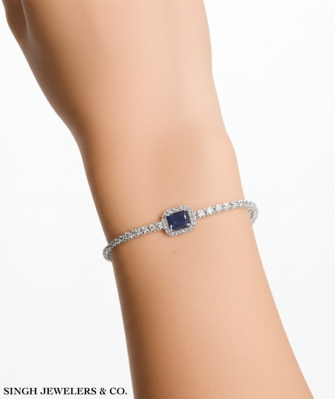 Model wearing 925 sterling silver blue sapphire cubic zirconia bracelet