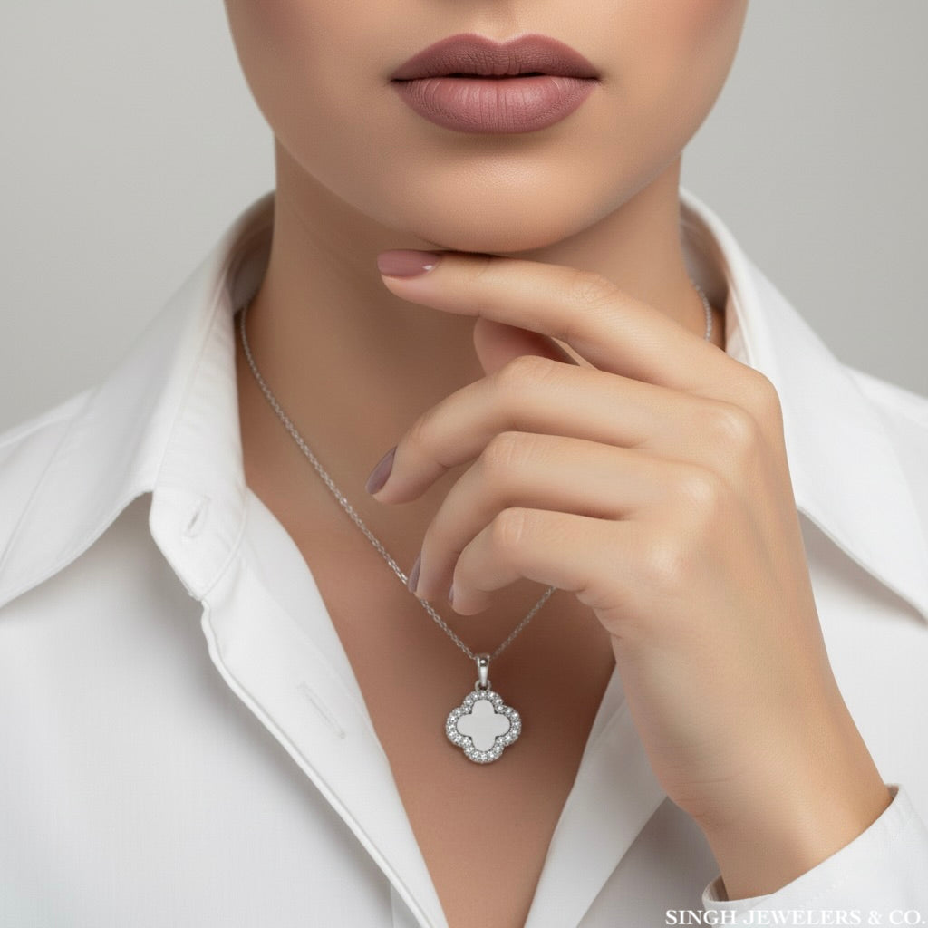 Van Cleef inspired white sapphire clover charm shown on model