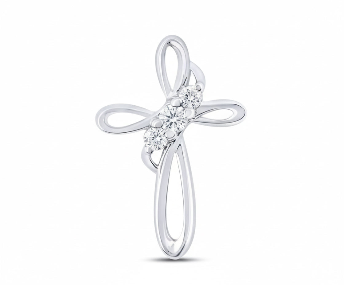 Silver cross pendant with clear stones on a white background