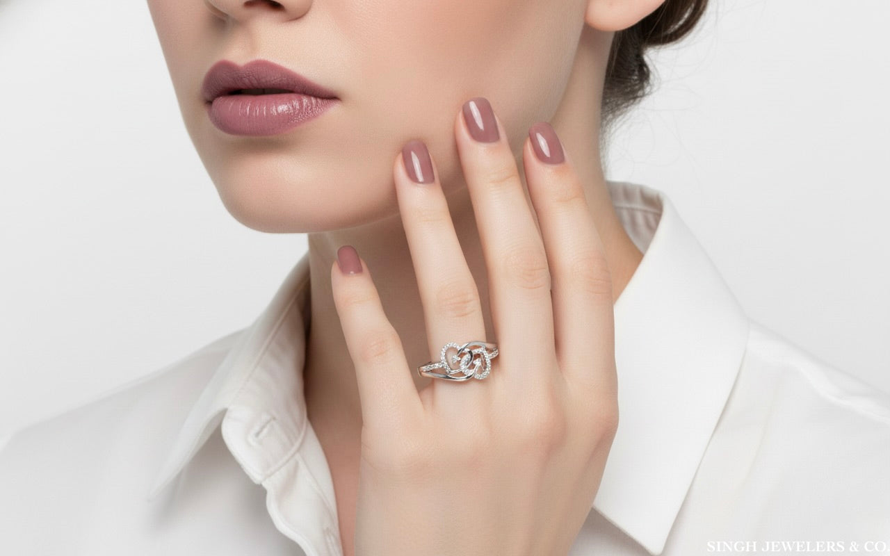 Close-up of diamonds on sterling silver double heart promise ring