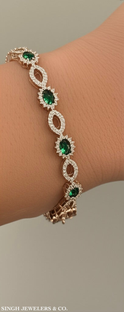 Sterling silver bracelet with emerald and white sapphire stones
