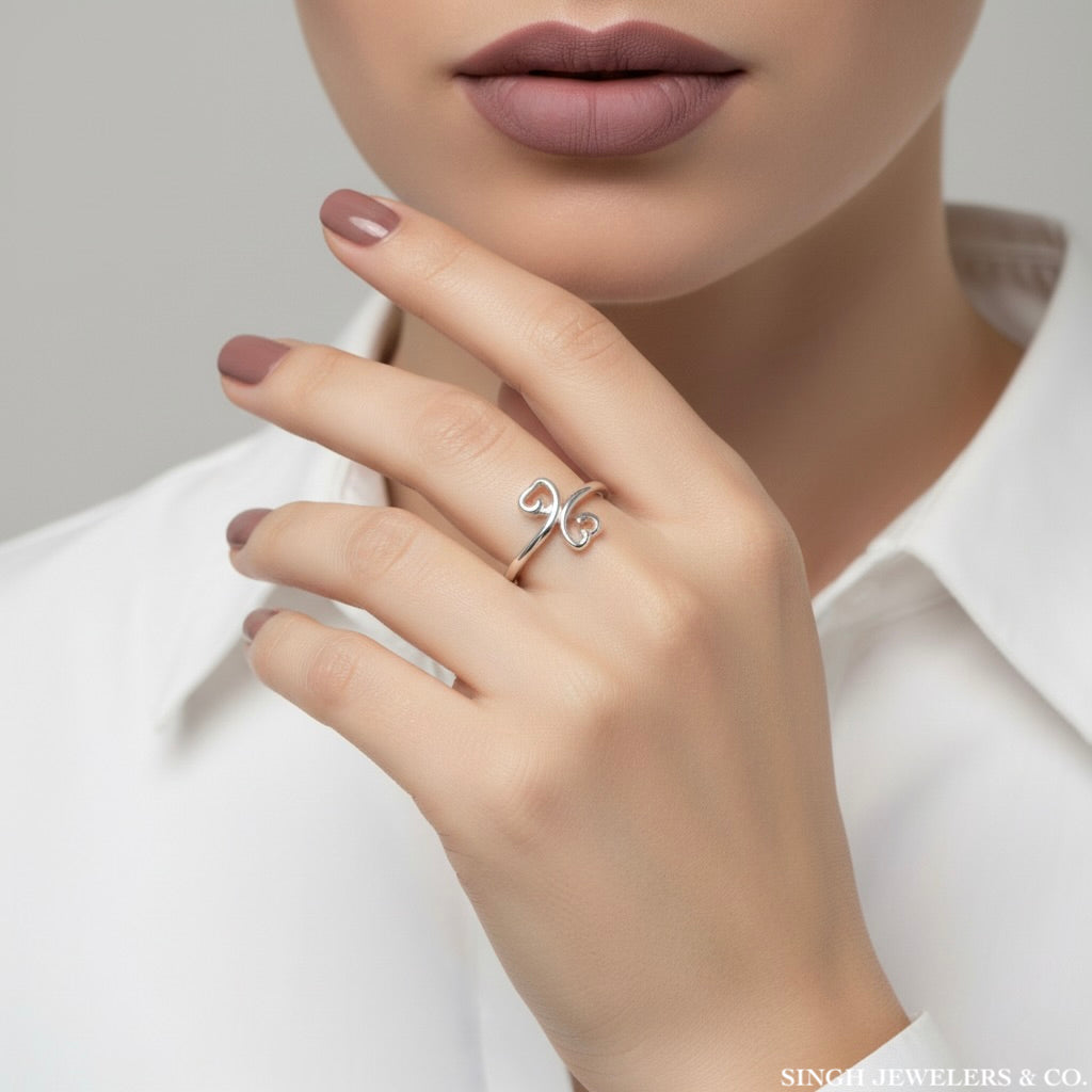 Sterling silver two hearts one love hearts ring on Singh Jewelers & Co woman model