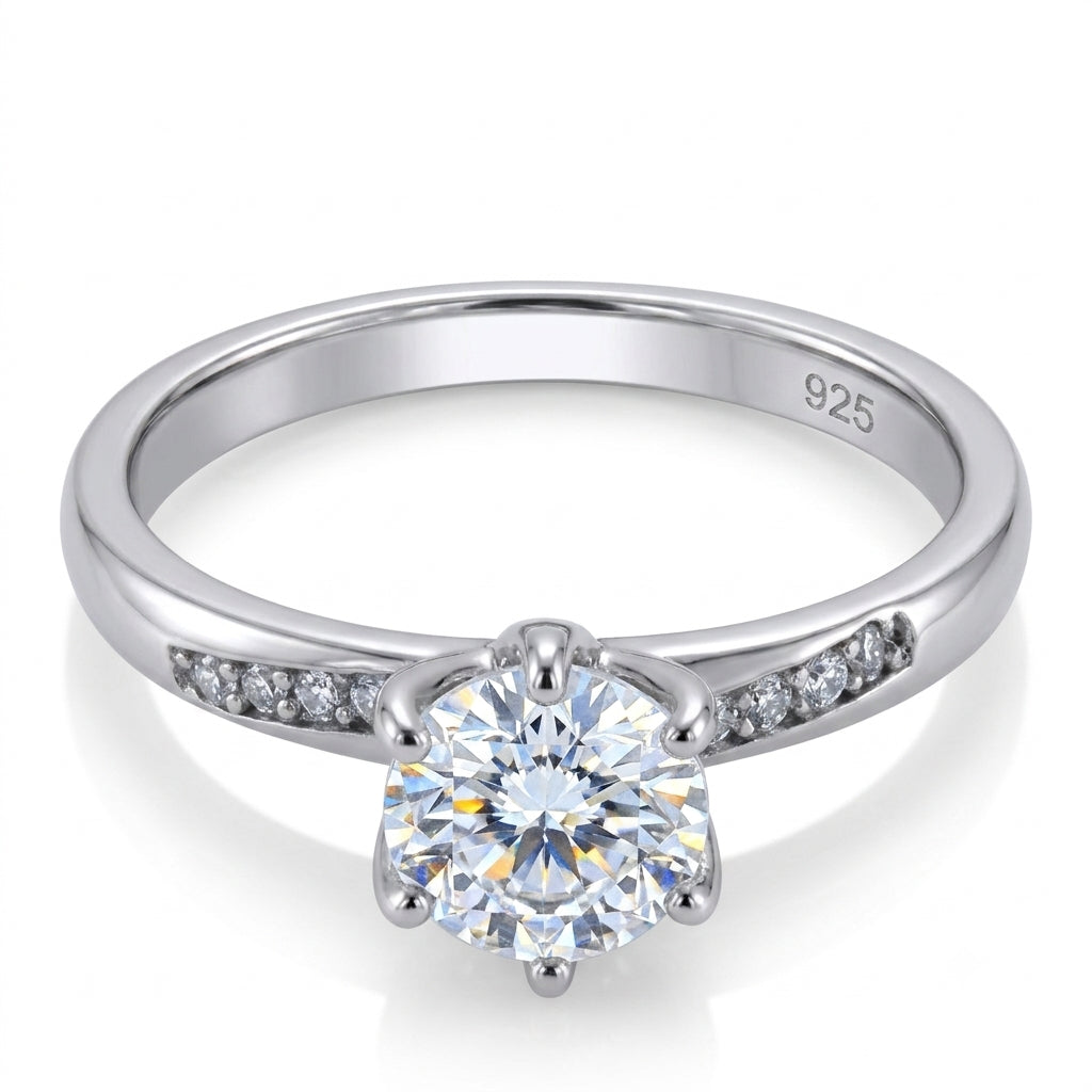 Silver ring with a moissanite diamond on a white background