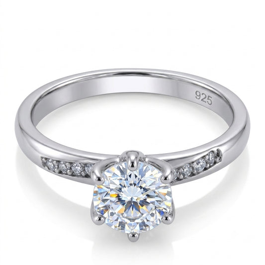 Silver ring with a moissanite diamond on a white background