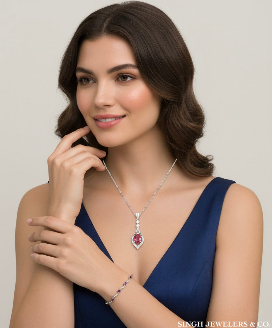 Sterling silver oval pendant with 1 CTTW lab-grown ruby and diamond solitaire