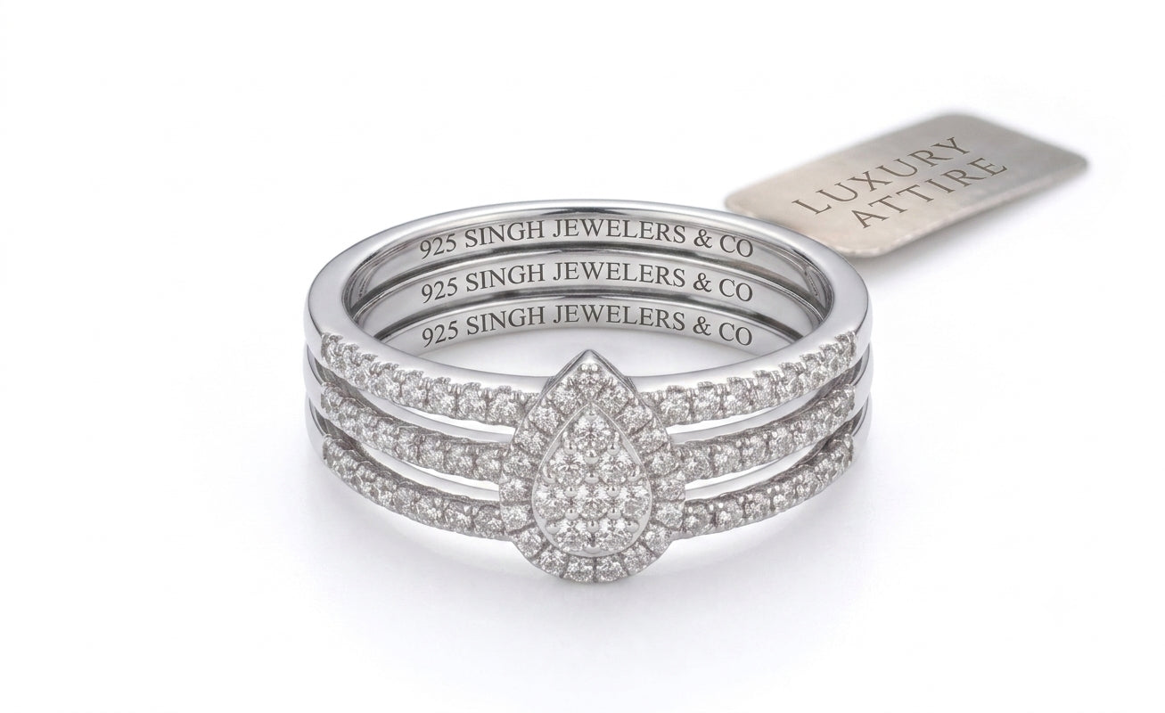 Sterling silver pear-shaped diamond bridal wedding ring set with round diamond accents, 1/4 carat total weight