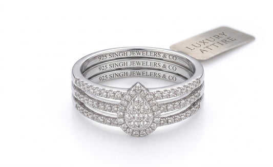 Sterling silver pear-shaped diamond bridal wedding ring set with round diamond accents, 1/4 carat total weight