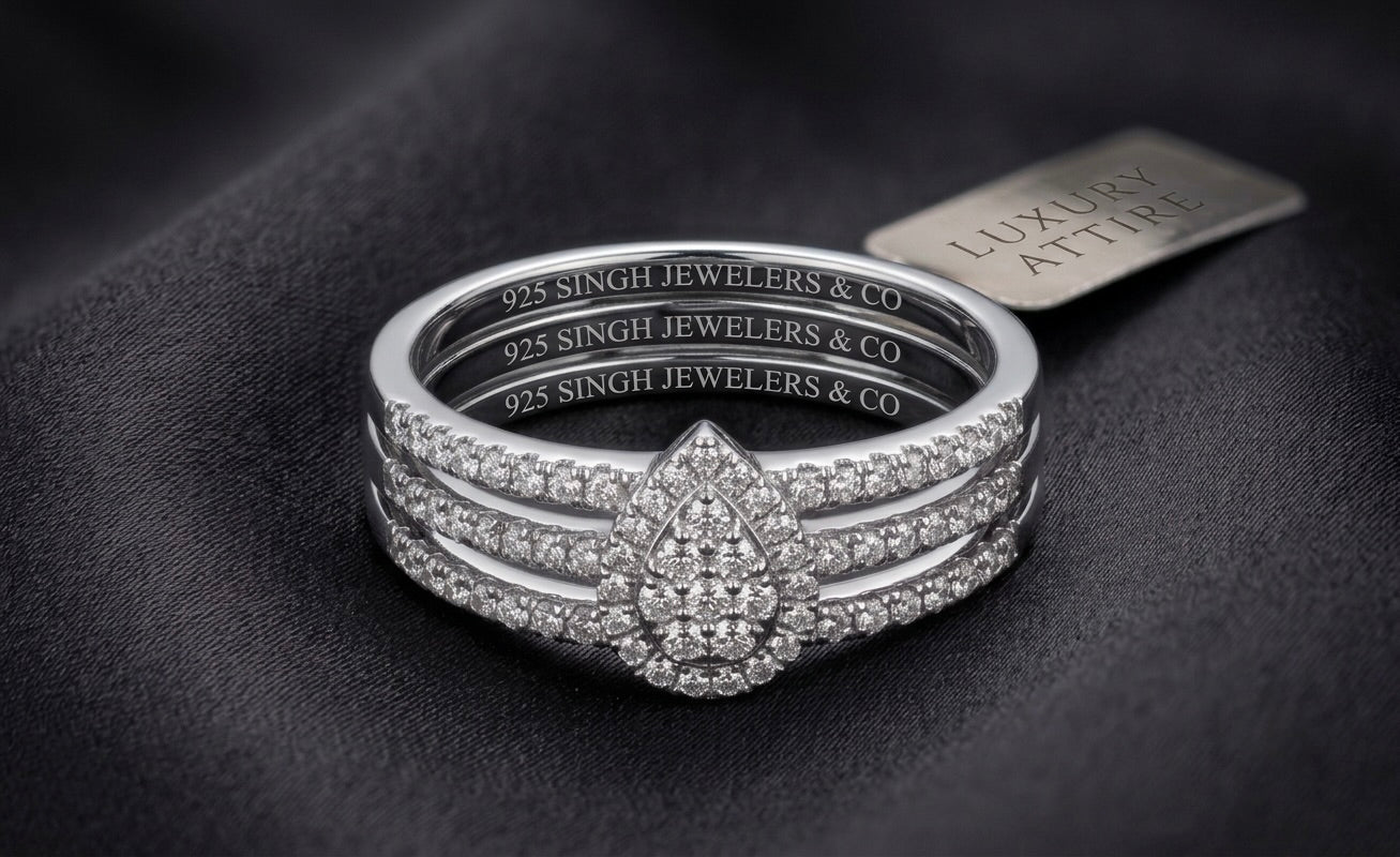 Front view of sterling silver pear-shaped diamond bridal wedding ring set