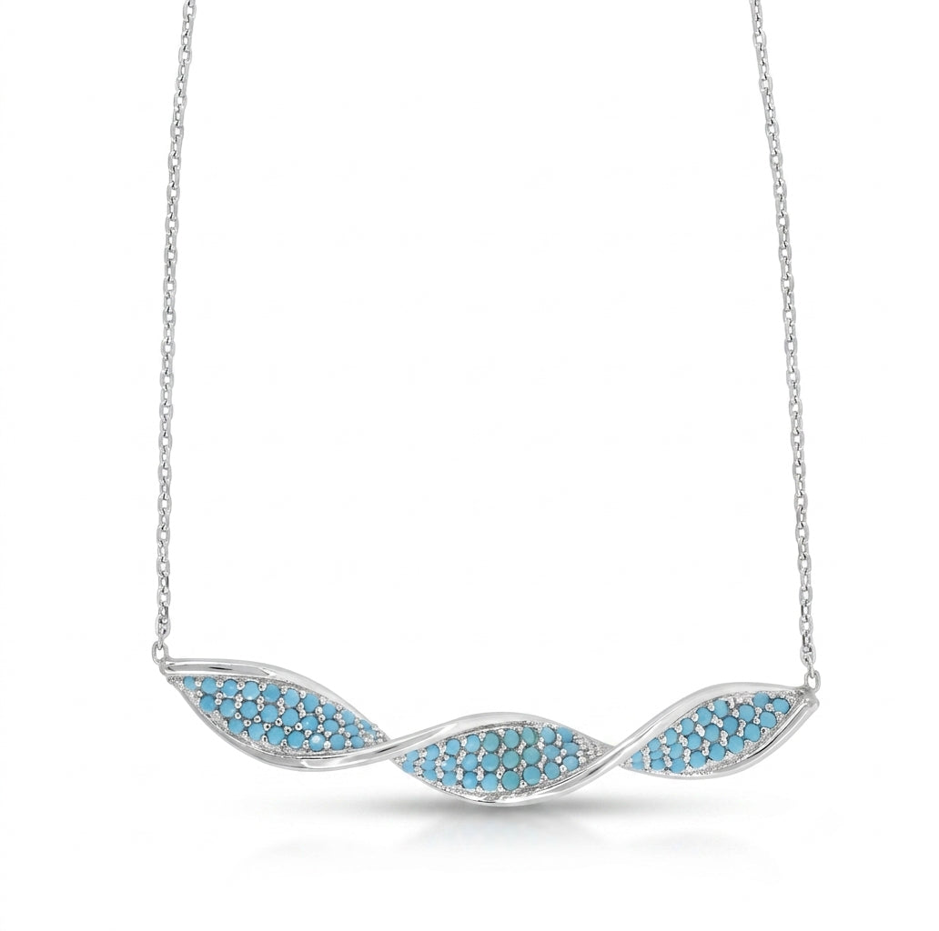 Close-up of sterling silver turquoise twisted bar pendant necklace