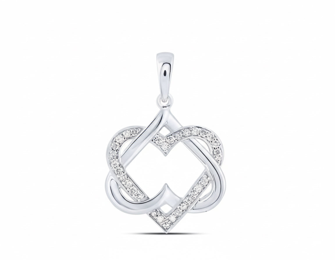 Silver pendant with heart design on a white background