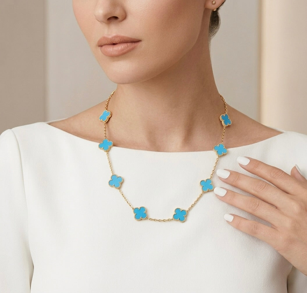 Clover shaped pendant necklace in 10K gold with sky blue stone inspired luxury vancleef design 