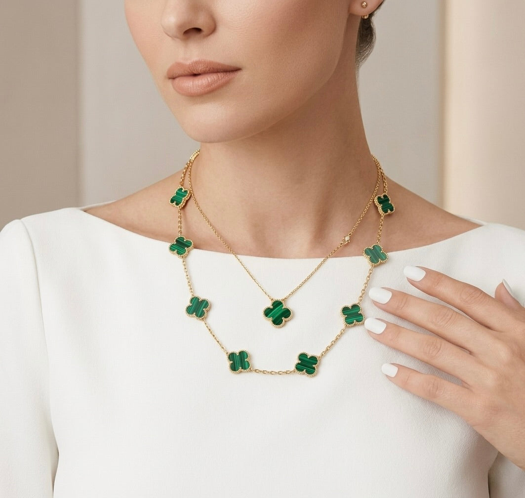 Close-up of green clover pendant necklace in 10K yellow gold luxury style jewelry