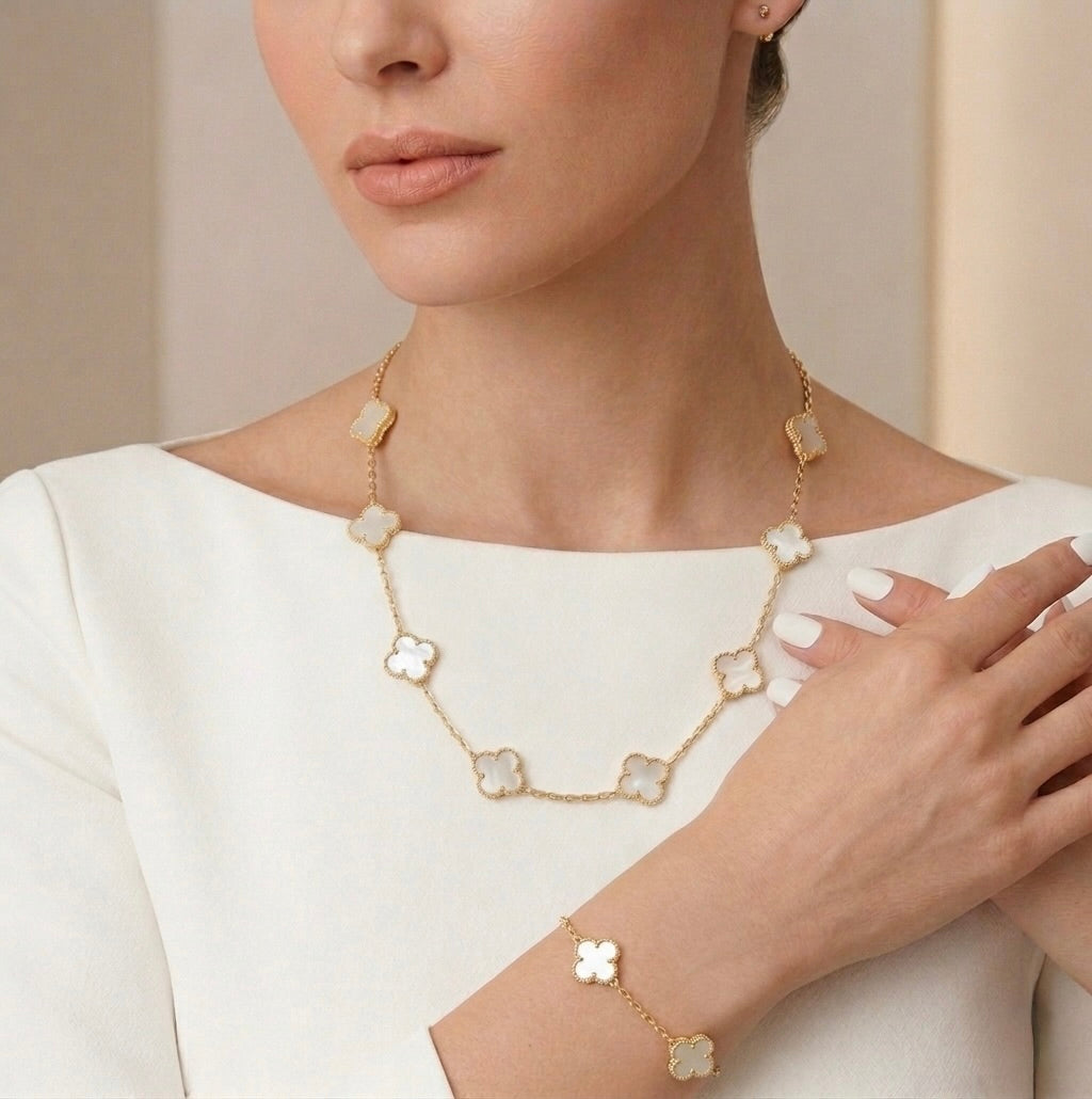 10K yellow gold clover vancleef necklace with white stone worn as elegant fashion jewelry