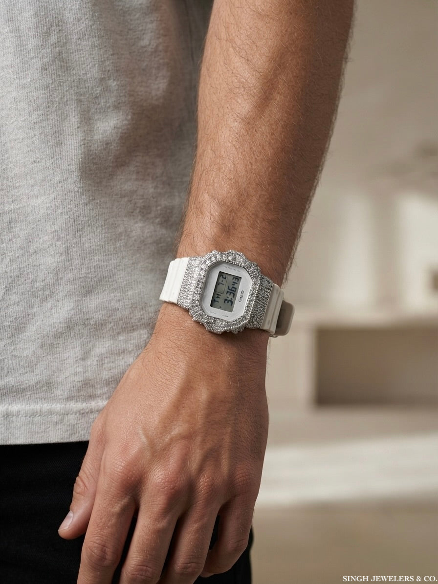 Luxury white Casio G-Shock watch with moissanite diamond-style stones and custom iced-out design.