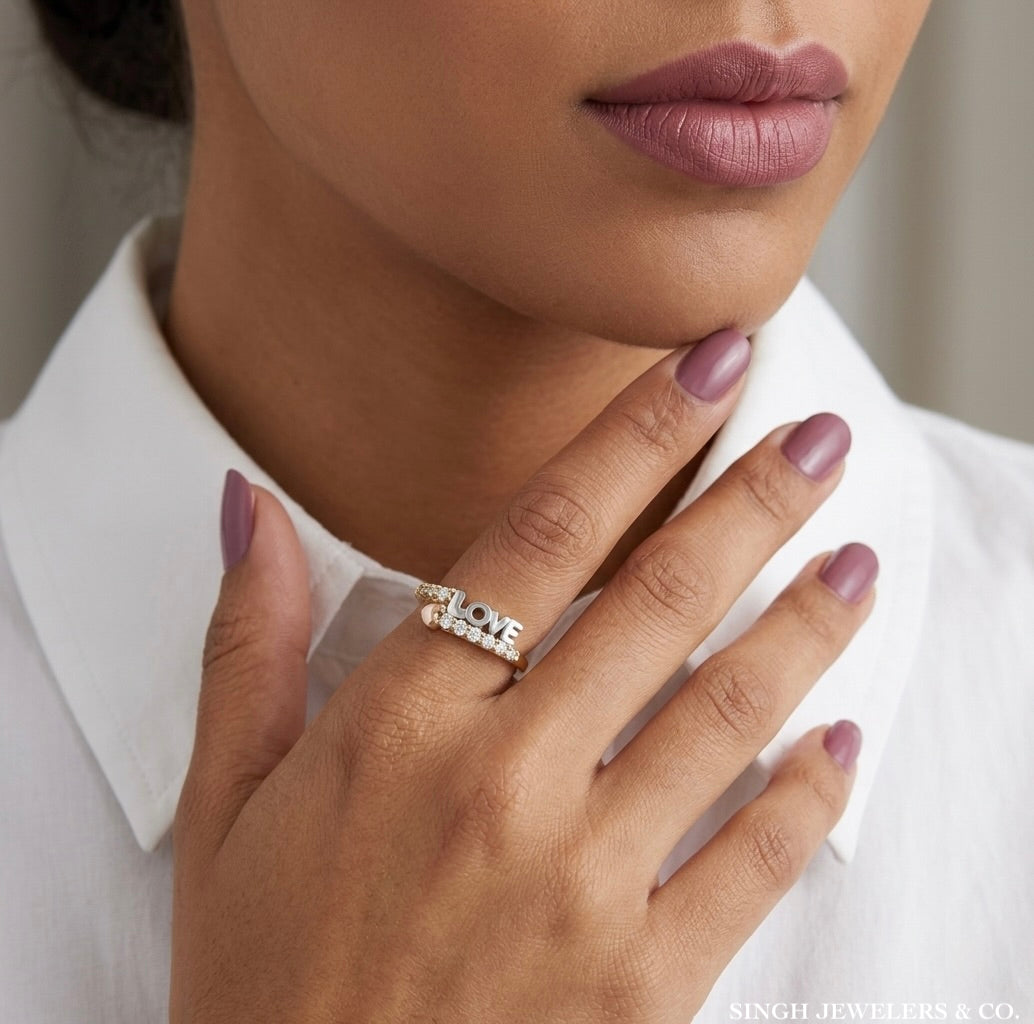 woman wearing 10K tri-tone love heart ring with elegant rose gold and white sapphire accents